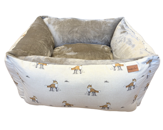 Dog bed with fox pattern on a white background
